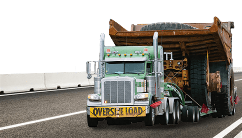 A large semi-trailer truck carrying a haul truck