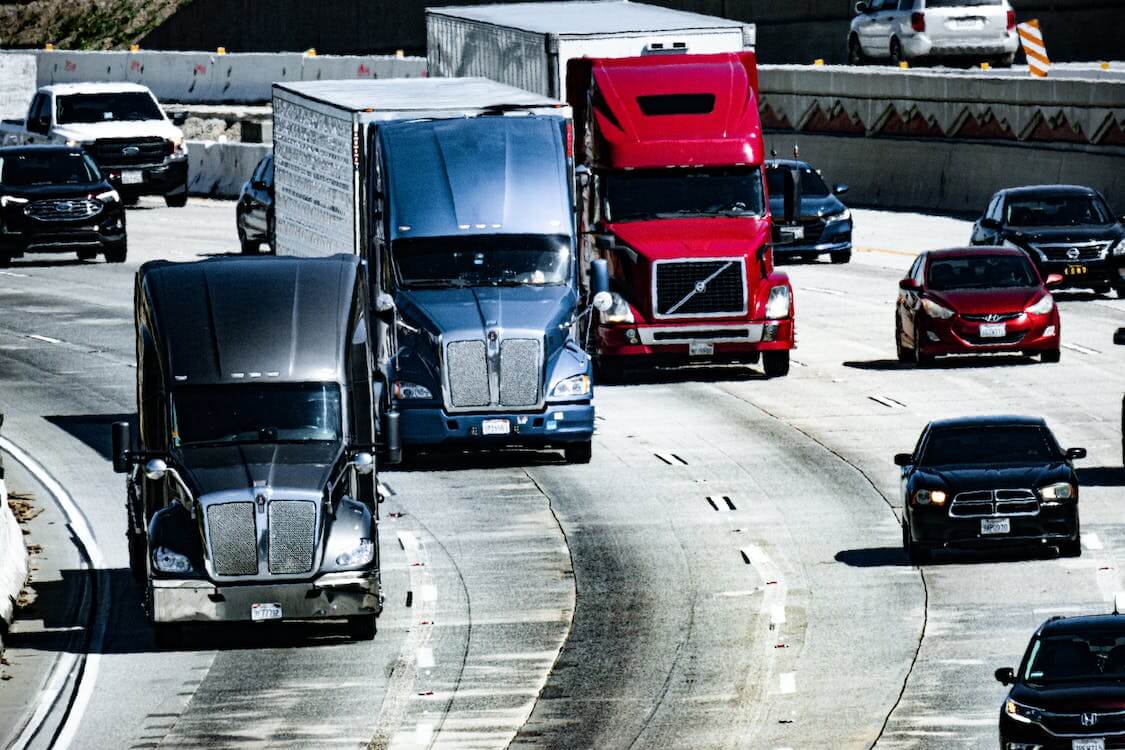 https://firstfrontier.ca/storage/2023/07/free-photo-of-trucks-and-cars-on-a-highway.jpeg