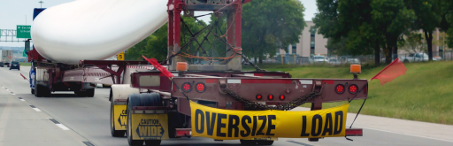 Truck transporting wide load oversized cargo